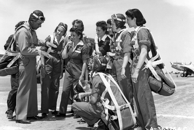 WASP trainees with their instructor pilot, most likely at Avenger Field in Sweetwater, Texas. A Fairchild PT-19 trainer sits in the background. (US Air Force)